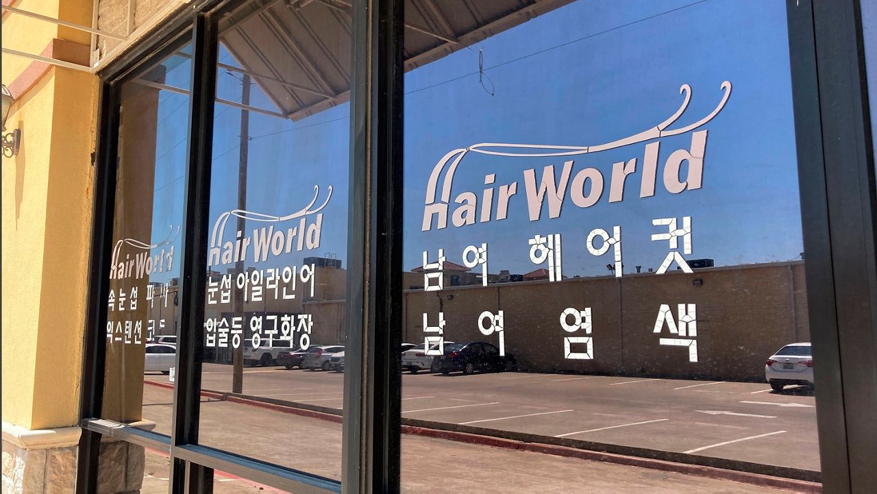 This photo shows the interior of Hair World Salon in Dallas on Thursday, May 12, 2022. Police searched Thursday for a man who opened fire inside the hair salon in Dallas' Koreatown area, wounding three people. Authorities do not yet know why the man shot the three female victims Wednesday afternoon at Hair World Salon, which is in a shopping center with many businesses owned by Korean Americans. (AP Photo/Jamie Stengle)