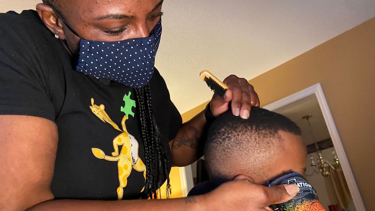 JacQuil Leathers cutting hair