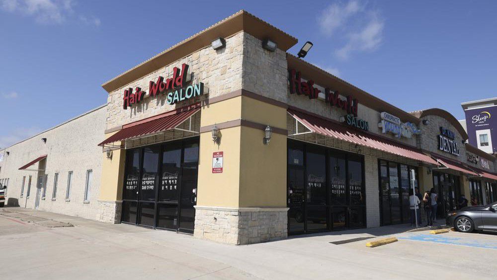 This photo shows the exterior of Hair World Salon on Thursday, May 12, 2022 in Dallas. Dallas' police chief said Friday, May 13, 2022 that a shooting that injured three women in a hair salon in the city's Koreatown might have been a hate crime as he announced that it could be connected to two other shootings at businesses run by Asian Americans. (Rebecca Slezak/The Dallas Morning News via AP)