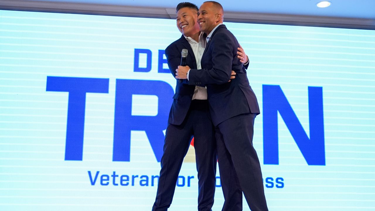 House Minority Leader Hakeem Jeffries, D-N.Y., greets Derek Tran during a campaign event at Golden Sea Restaurant on Saturday in Anaheim, Calif. (AP Photo/Julia Demaree Nikhinson)