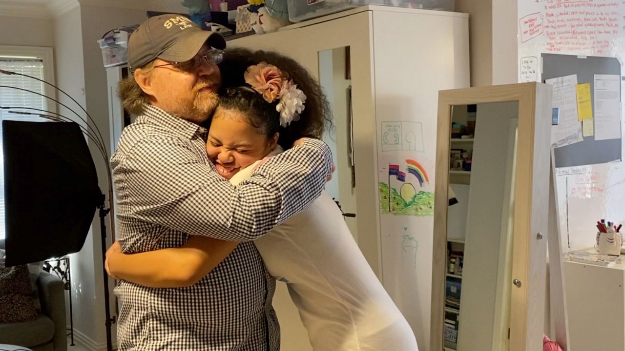 Haley with her father, William Schlitz. (Lupe Zapata/Spectrum News 1)