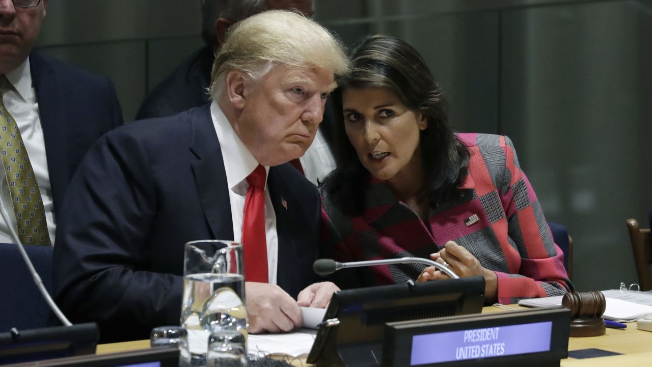 President Donald Trump talks to Nikki Haley, the U.S. ambassador to the United Nations, at the United Nations General Assembly at U.N. headquarters on Sept. 24, 2018. (AP Photo/Evan Vucci, File) 