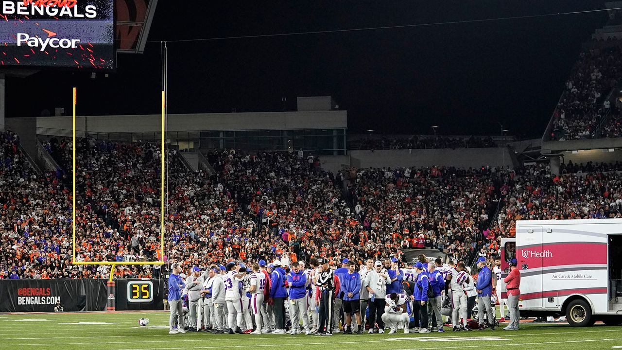 Buffalo Bills players pray for teammate Damar Hamlin during the first half of an NFL football game against the Cincinnati Bengals, Monday, Jan. 2, 2023, in Cincinnati. (AP Photo/Joshua A. Bickel)