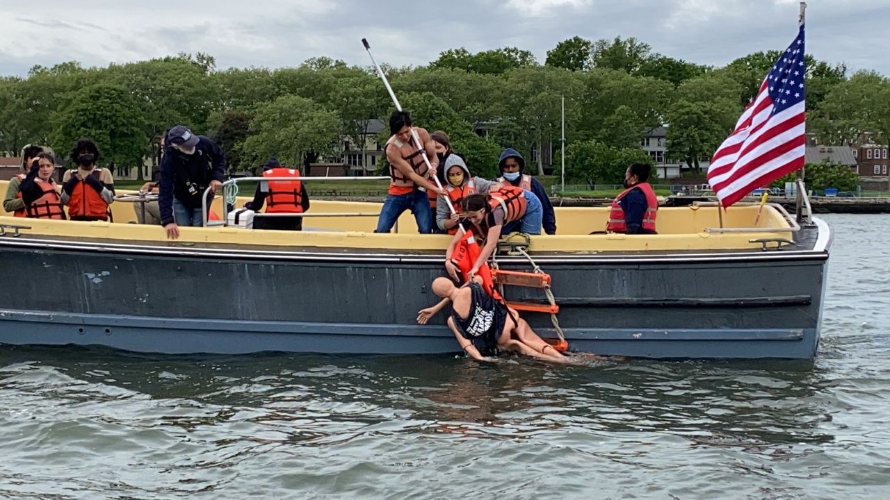 Students get out of the classroom and onto the water