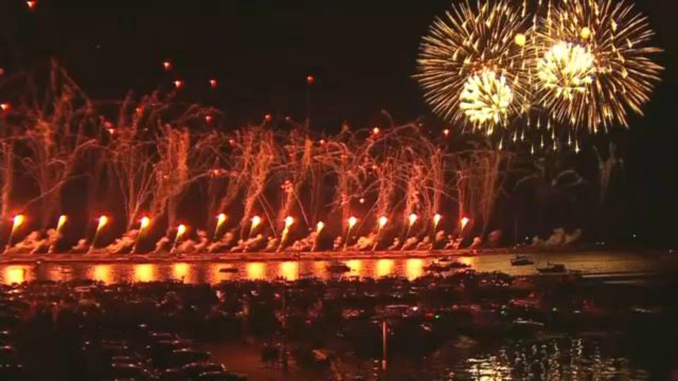 Harborfest fireworks explode over the bay.