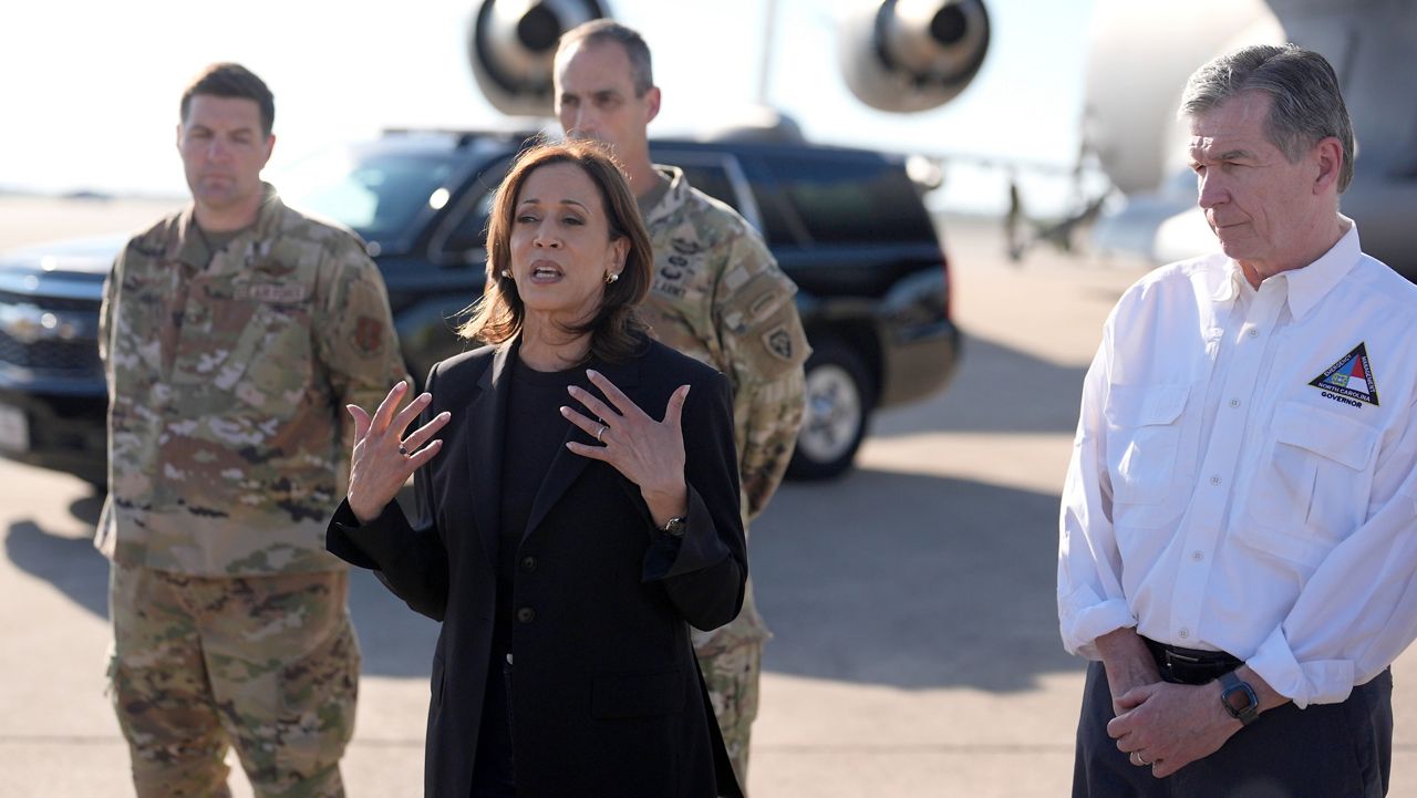 Democratic presidential nominee Vice President Kamala Harris speaks alongside North Carolina Gov. Roy Cooper, right, after receiving a briefing on the damage from Hurricane Helene, Saturday, October 5, 2024, at the 145th Airlift Wing of the North Carolina Air National Guard in Charlotte, N.C. (AP Photo/Chris Carlson)