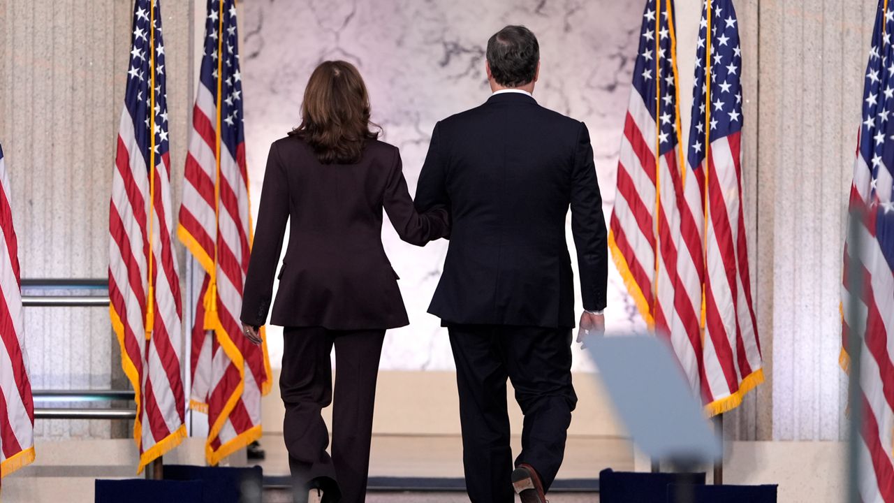 Second gentleman Doug Emhoff, right, walks with Vice President Kamala Harris as she departs after delivering a concession speech for the 2024 presidential election on the campus of Howard University in Washington, Wednesday, Nov. 6, 2024. (AP Photo/J. Scott Applewhite)