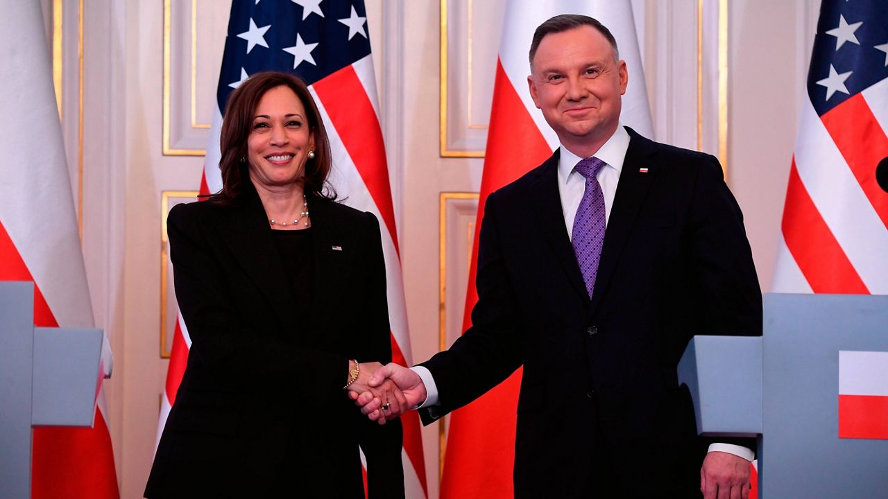 Polish President Andrzej Duda, right, shakes hands with U.S. Vice President Kamala Harris at Belwelder Palace, in Warsaw, Poland, Thursday. (Saul Loeb/Pool Photo via AP)