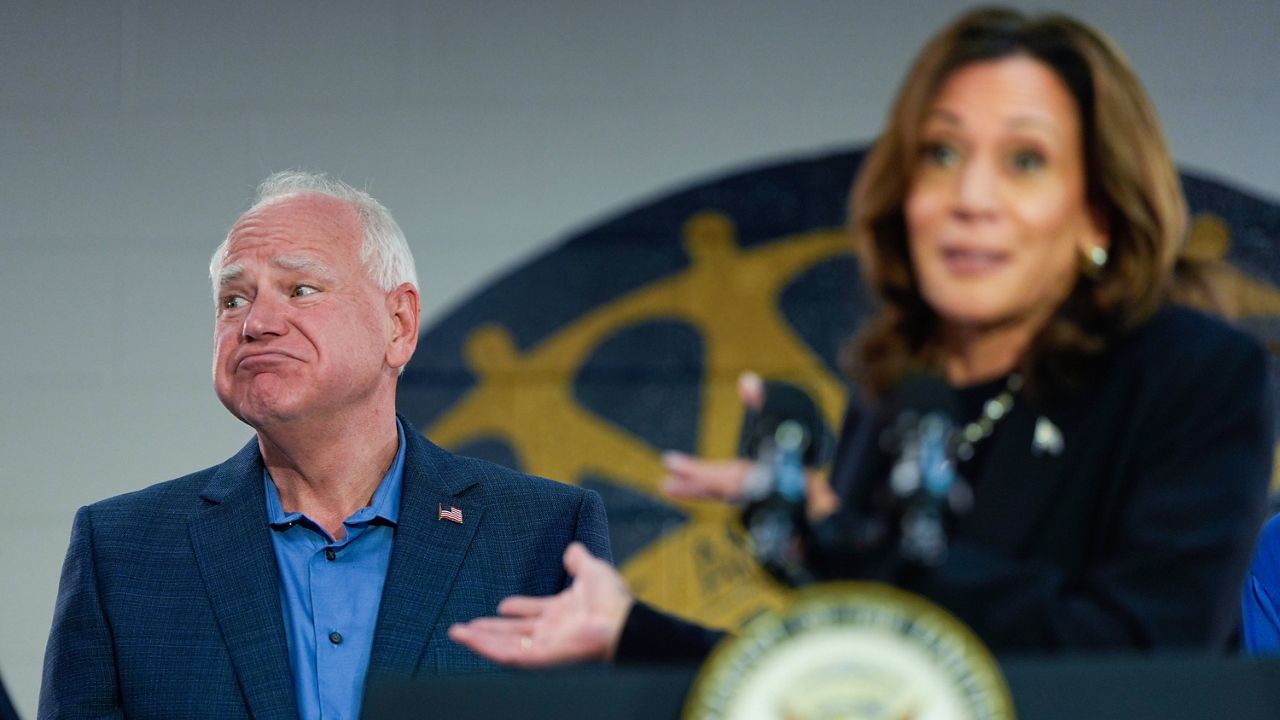 Democratic presidential nominee Vice President Kamala Harris, with Democratic vice presidential nominee Minnesota Gov. Tim Walz, left, speaks at a campaign rally at UAW Local 900, Thursday, August 8, 2024, in Wayne, Mich. (AP Photo/Julia Nikhinson)