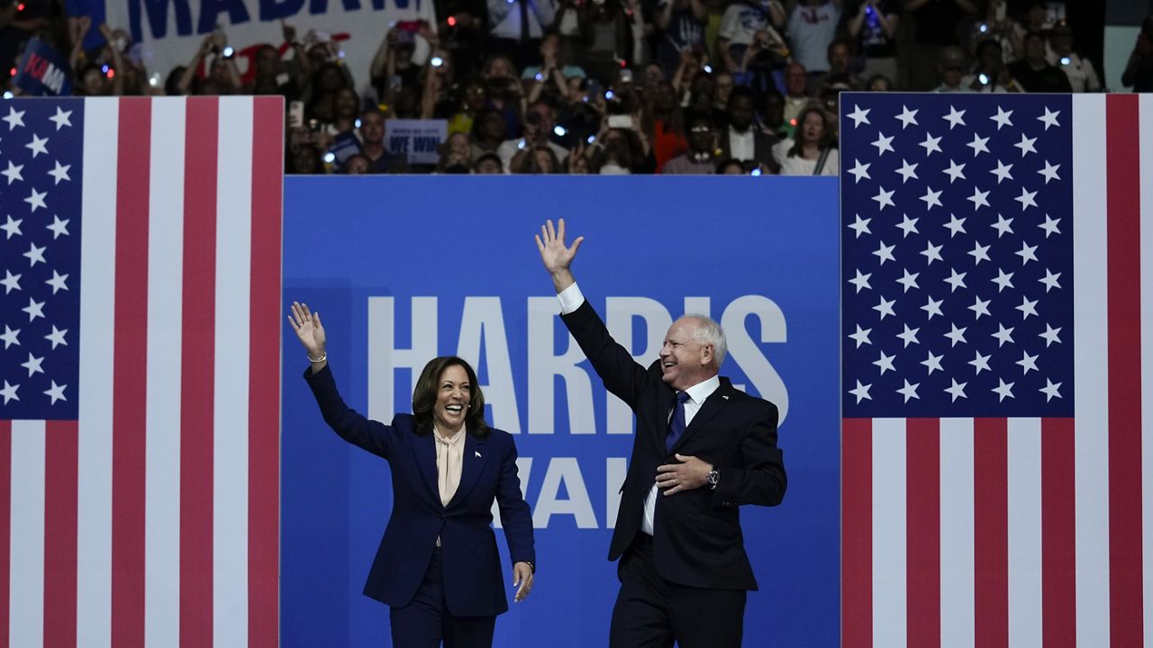 Democratic presidential nominee Vice President Kamala Harris and her running mate Minnesota Gov. Tim Walz arrive at a campaign rally in Philadelphia, Tuesday, Aug. 6, 2024. (AP Photo/Matt Rourke, File)