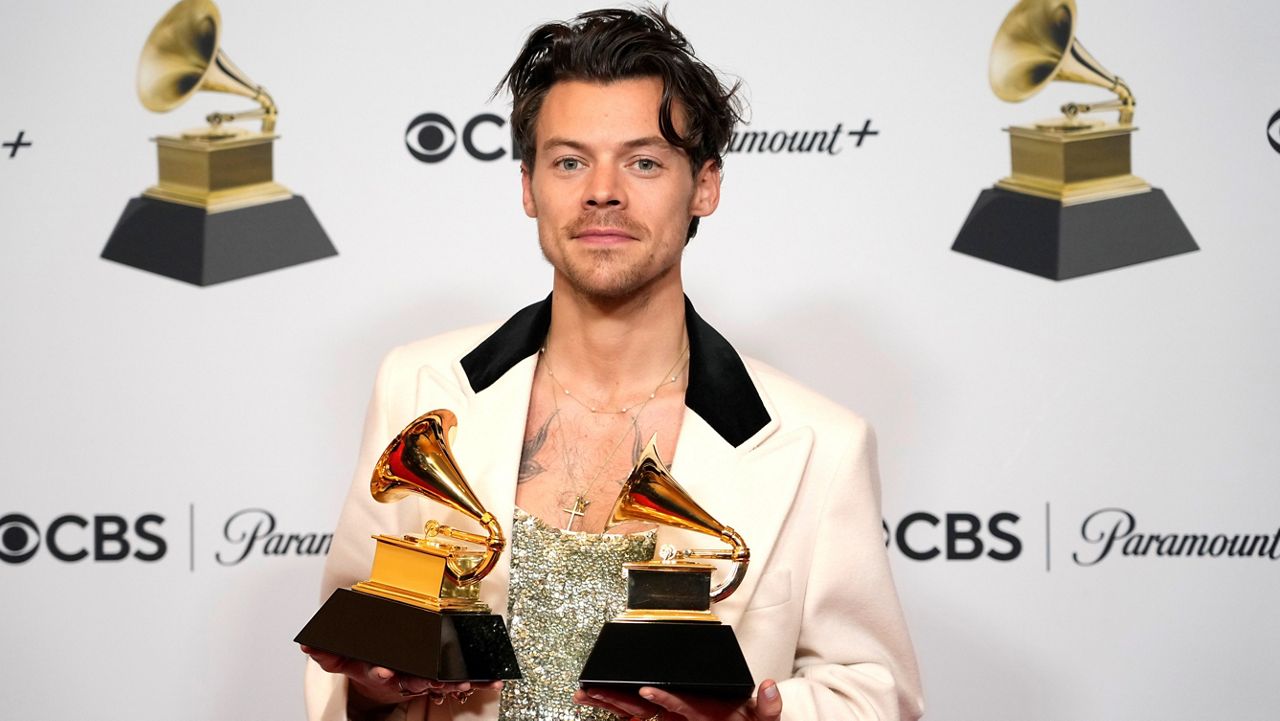 Harry Styles, winner of the award for album of the year for "Harry's House" and best pop vocal album for "Harry's House," poses in the press room at the 65th annual Grammy Awards on Sunday, Feb. 5, 2023, in Los Angeles. (AP Photo/Jae C. Hong)