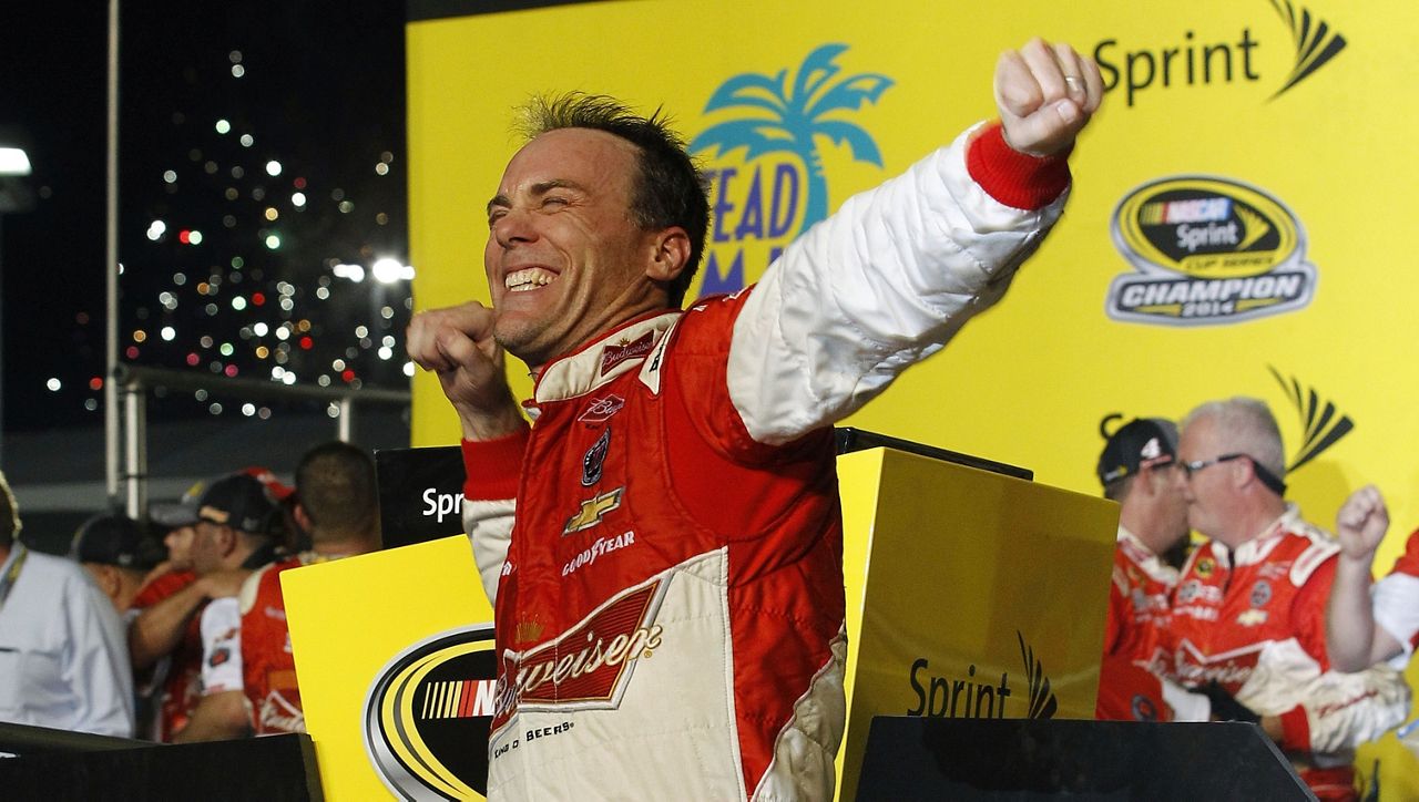 Kevin Harvick celebrates after winning the NASCAR Sprint Cup championship series auto race, Sunday, Nov. 16, 2014, in Homestead, Fla. Kevin Harvick said Thursday, Jan. 12, 2023, he will retire from NASCAR competition at the end of the 2023 season. (AP Photo/Terry Renna)