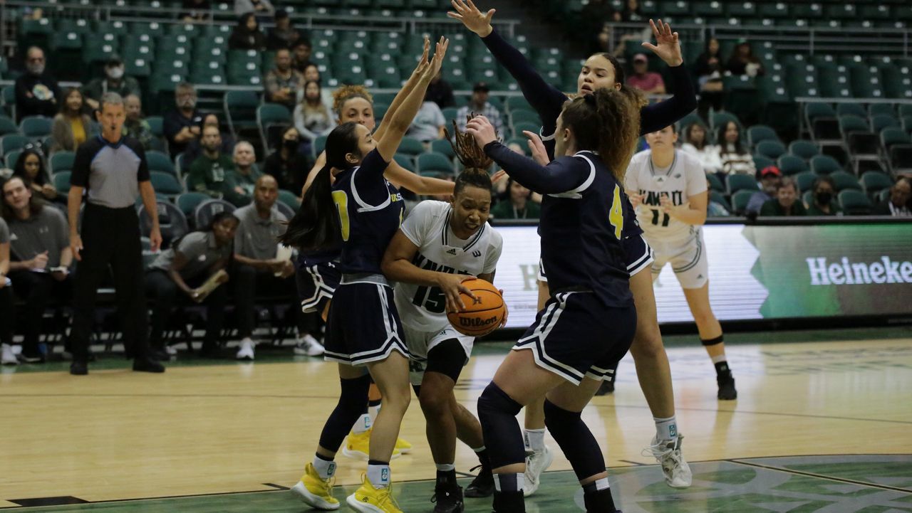 UC San Diego players built a house around Hawaii forward Daejah Phillips as she attempted to drive into the paint in the second half on Thursday.