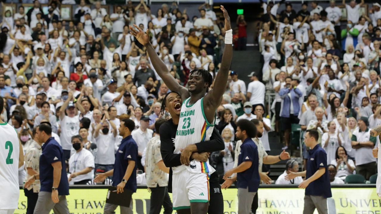 Freshman center Mor Seck got a hug from the injured Bernardo da Silva after Hawaii defeated UC Irvine 72-67 in the 2022-23 home finale.