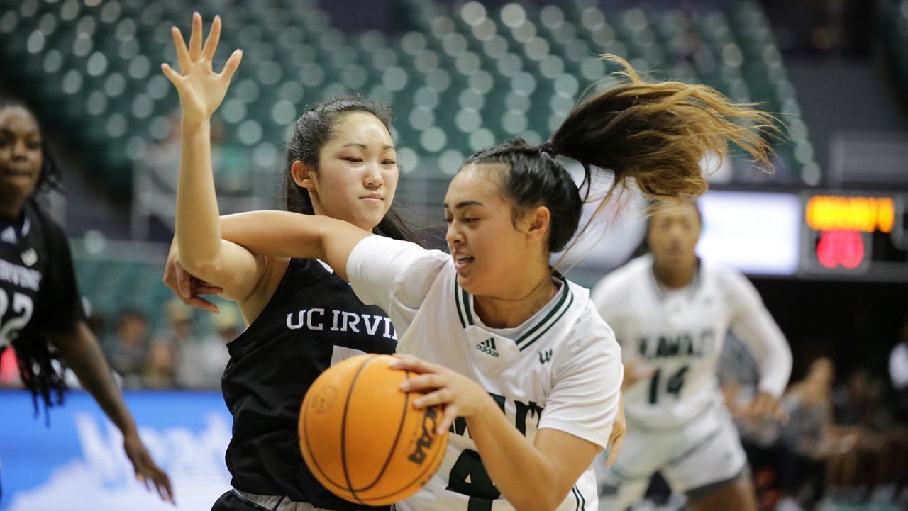 Hawaii freshman guard Jovi Lefotu, seen driving against UC Irvine's Nikki Tom on Jan. 19, suffered an apparent injury with seconds left of a 72-69 loss at UC Santa Barbara on Thursday.