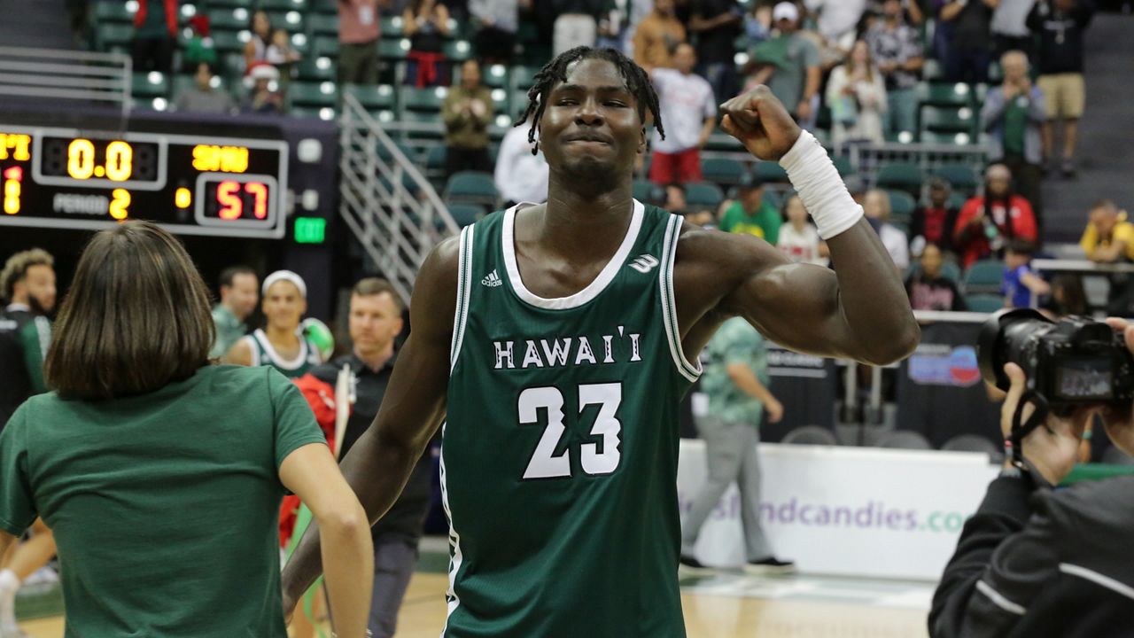 Freshman center Mor Seck celebrated on the Stan Sheriff Center court after Hawaii's improbable comeback to win its first Diamond Head Classic on Sunday.