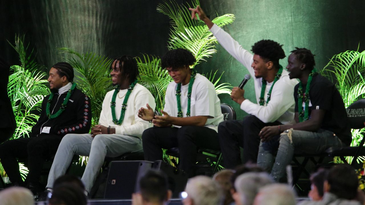 Forward Bernardo da Silva waved at friends while seated next to, from left, JoVon McClanahan, Zoar Nedd, Beon Riley and Amoro Lado. (Spectrum News/Brian McInnis)