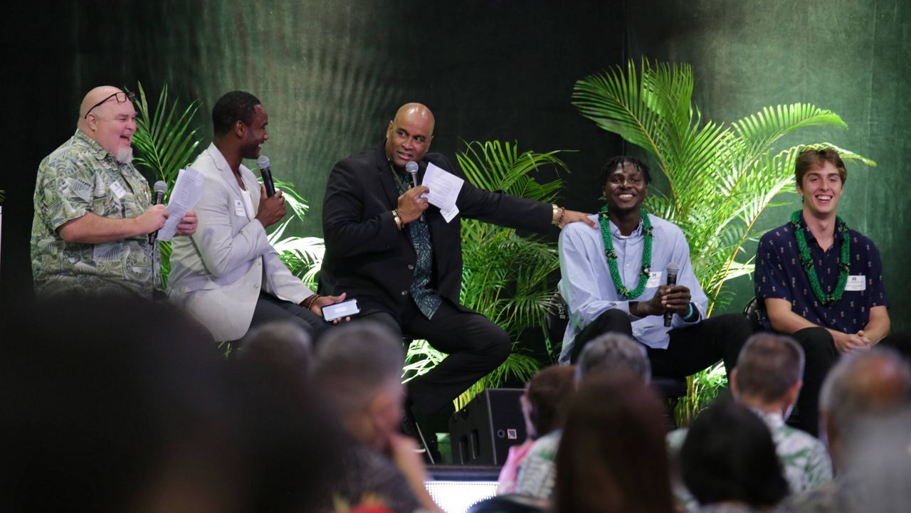 Forward Bernardo da Silva waved at friends while seated next to, from left, JoVon McClanahan, Zoar Nedd, Beon Riley and Amoro Lado. (Spectrum News/Brian McInnis)