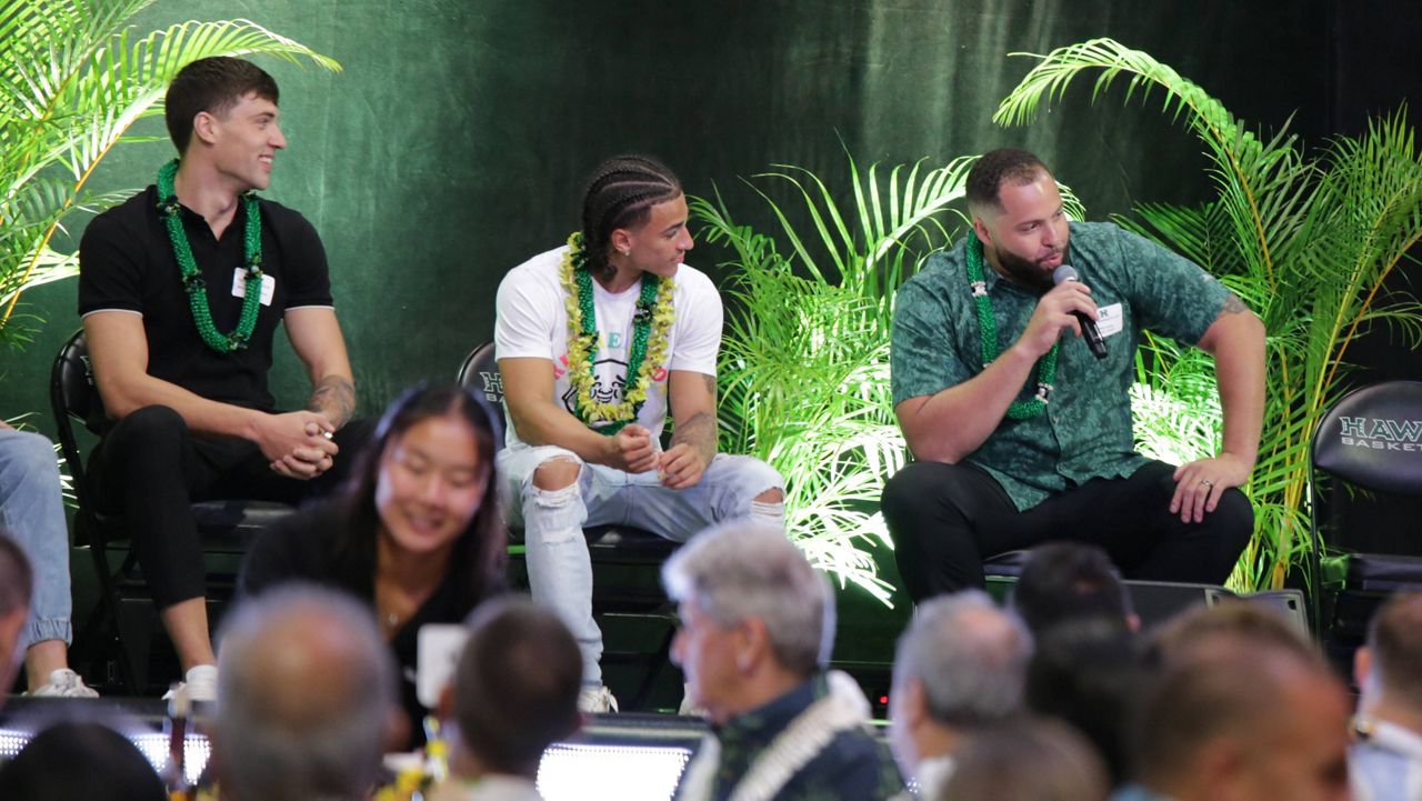 Forward Bernardo da Silva waved at friends while seated next to, from left, JoVon McClanahan, Zoar Nedd, Beon Riley and Amoro Lado. (Spectrum News/Brian McInnis)