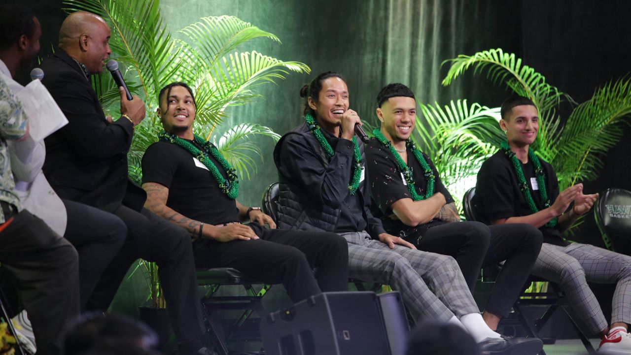 Hawaii basketball forward Kamaka Hepa, middle, answered questions from Spectrum Sports' Kawika Hallums, left, at the team's annual tipoff banquet on Tuesday night while flanked by teammates Noel Coleman, Samuta Avea and Juan Munoz.