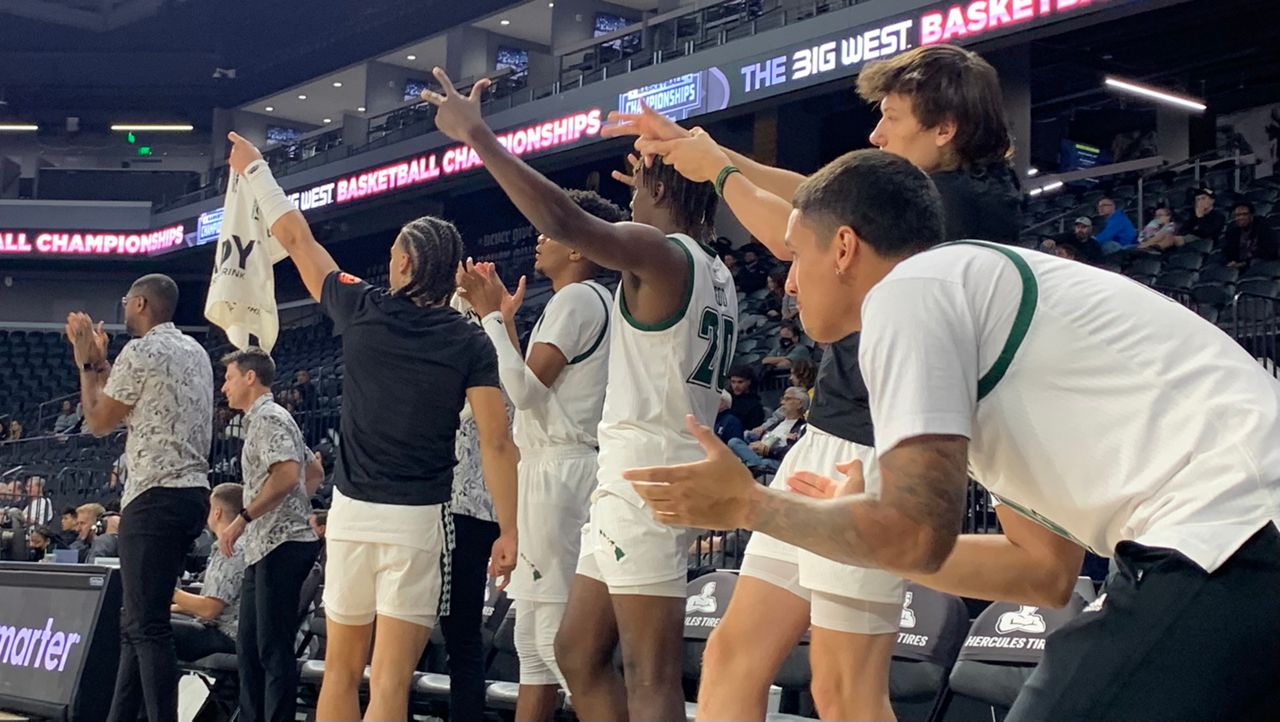 The Hawaii bench reacted after a 3-point basket in the second half of Thursday's quarterfinal against UC Riverside.