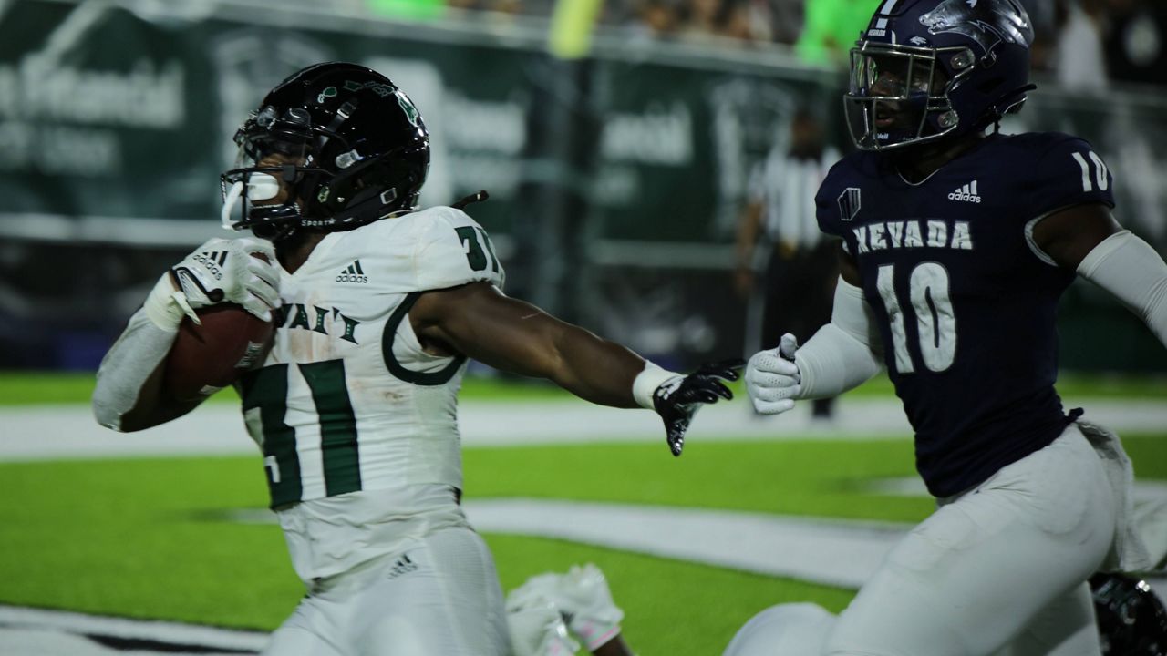 Hawaii running back Dedrick Parson evaded Nevada defensive back Tyriq Mack for his second of three touchdowns on the night.