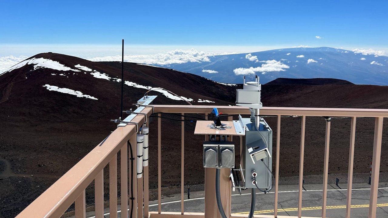 NOAA scientists installed an intake tube at the UH 88-inch observatory on Mauna Kea. (Photo courtesy of the University of Hawaii)