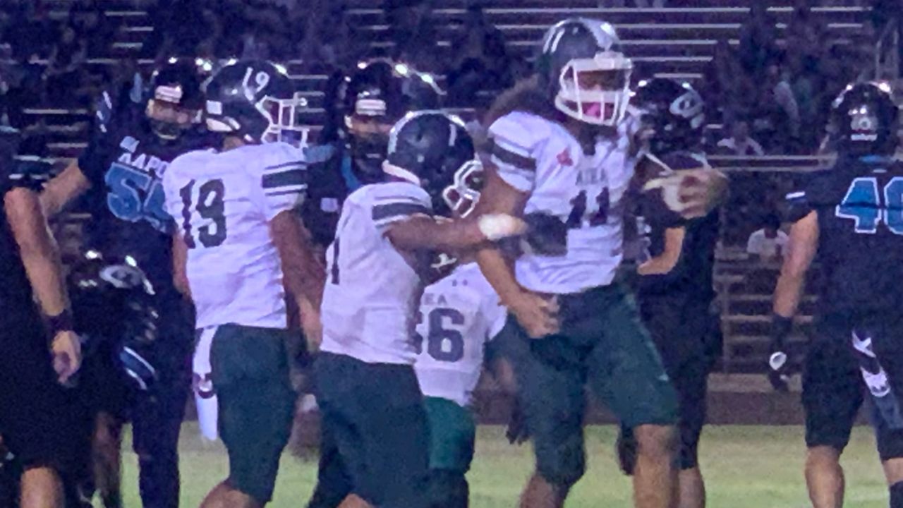 Aiea quarterback Eziekiel Olie, right, nearly led his team to a remarkable comeback at Kapolei on Friday night.