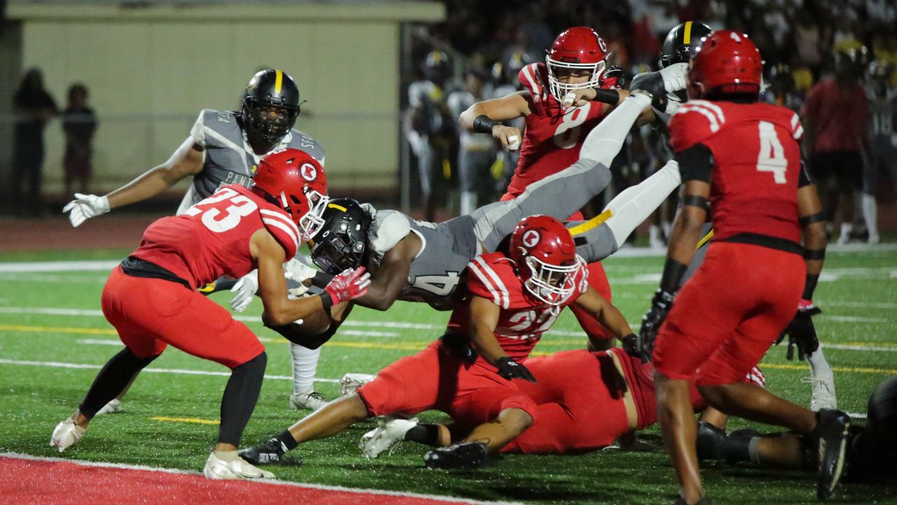 The Kahuku defense held against airborne St. Frances running back DeJuan Williams on Friday night.