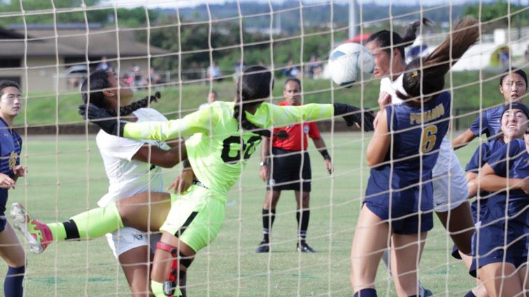 Kamehameha's Sarah Naumu, right, in white, headed in the go-ahead goal in the 46th minute of the ILH girls soccer playoff against Punahou on Wednesday at the Waipio Peninsula Soccer Complex. Punahou freshman goalkeeper Xeyana Salanoa twisted but couldn't get a hand on the ball. 