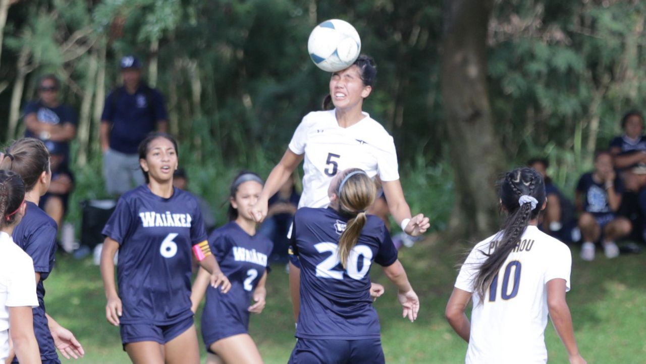 Punahou's Dalen Lau jumped to head the ball in the state quarterfinals against Waiakea on Thursday. Lau and the Buffanblu face Kamehameha in Saturday night's championship at Waipahu High after beating Mililani 1-0 on Lau's goal Friday.