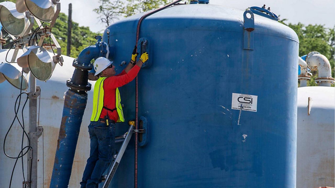 A Naval contractor prepares a granular activated carbon filtration system to begin Red Hill Well recovery efforts at the facility. (Courtesy: U.S. Navy)