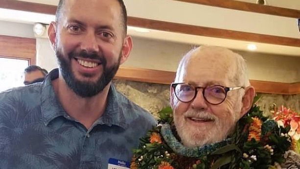 Jim Leahey, right, with son Kanoa at his retirement party in August 2018.