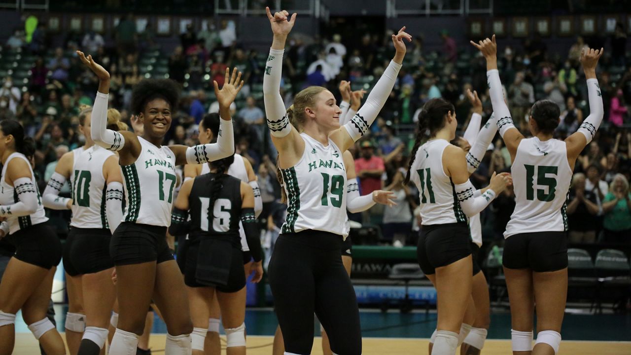 Utility player Chandler Cowell, middle, and the Rainbow Wahine celebrated a businesslike sweep of Cal State Fullerton on Saturday night.