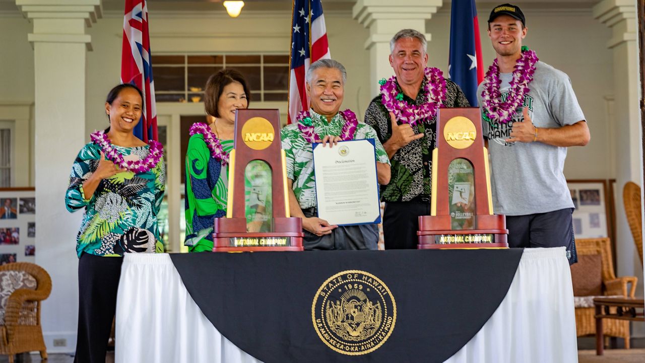 Gov. David Ige, center, welcomed the two-time national championship Hawaii men's volleyball team, including coach Charlie Wade and setter Jakob Thelle, right, to Washington Place for the second straight year. 