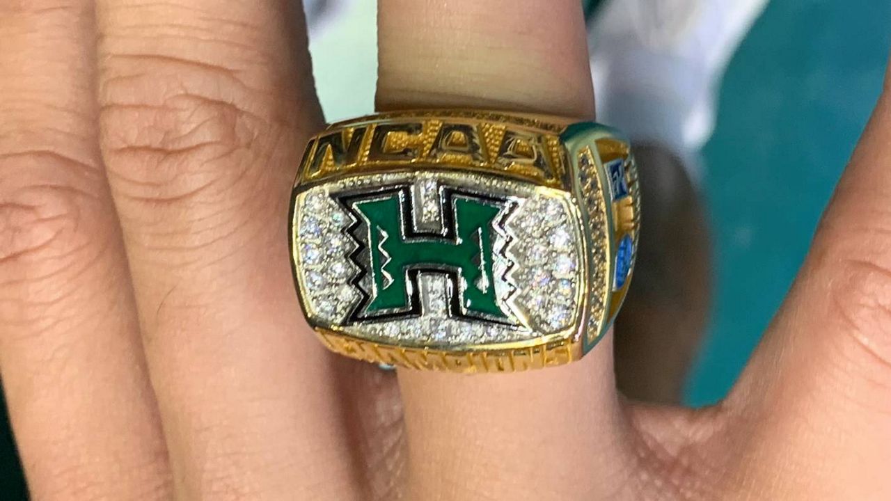 Hawaii hitter Kana‘i Akana showed off his 2021 NCAA championship ring that he received following Friday's four-set win over Long Island University. 