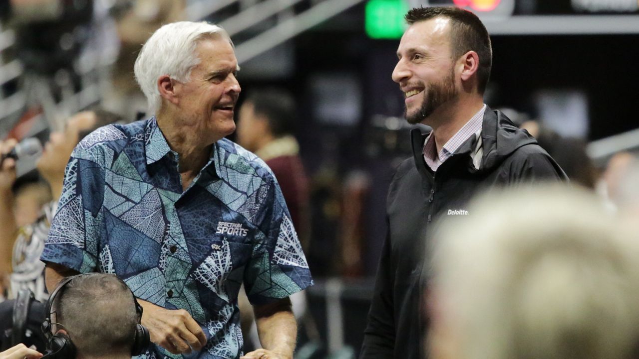 Former Hawaii men's volleyball standout Costas Theocharidis, right, shared a laugh with Spectrum Sports color analyst Chris McLachlin at Wednesday night's match against Pepperdine.