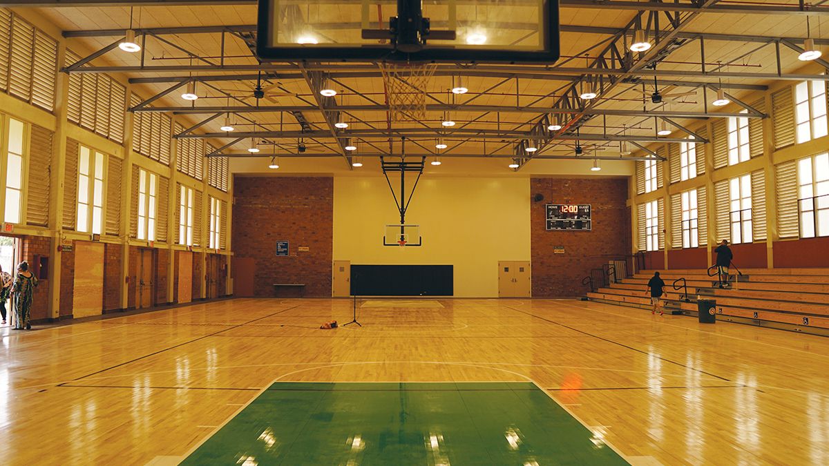 The community gym at George Fred Wright Wahiawa District Park reopened Friday sporting the Leilehua High School colors, green and gold, on its basketball court. (Spectrum News/Sarah Yamanaka)