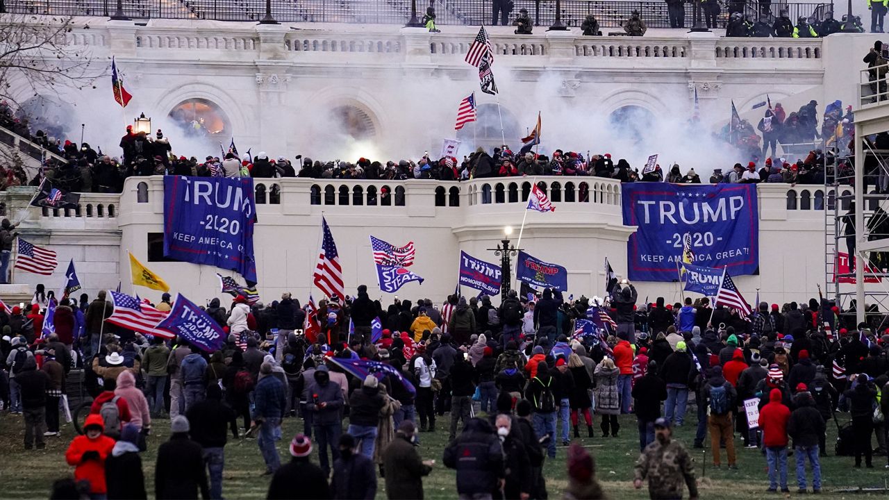 FILE - In this Wednesday, Jan. 6, 2021, file photo, violent rioters storm the Capitol, in Washington. (AP Photo/John Minchillo, File)