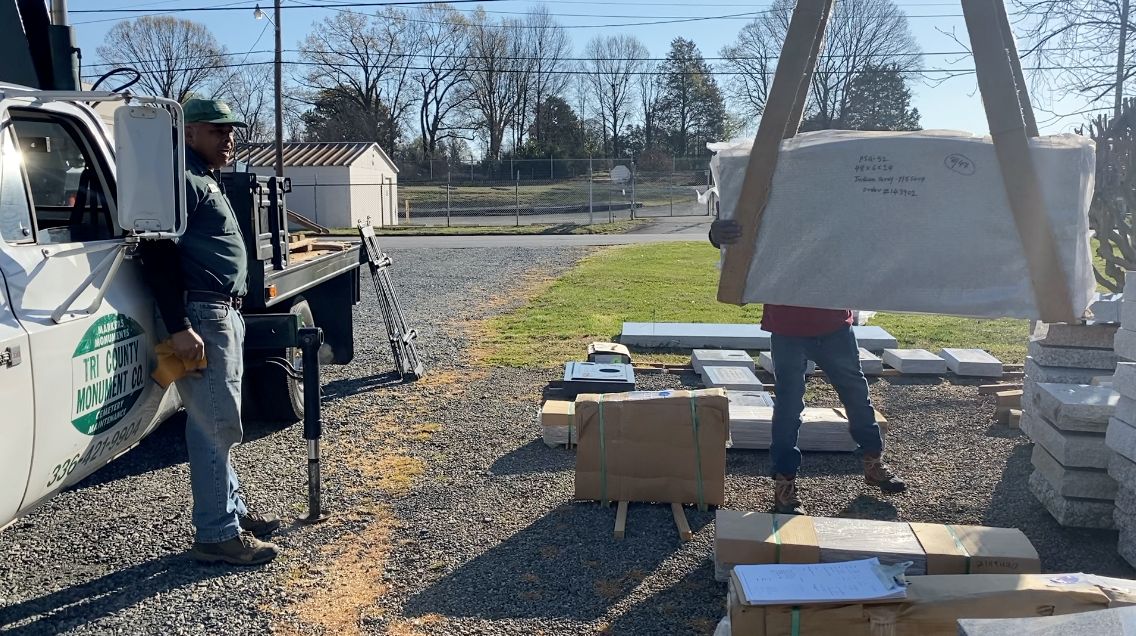 Tri-County Monuments loads up headstone for installation 