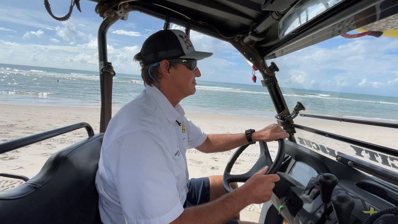 Surf City Deputy Fire Chief Tim Hobbs patrols the beach. (Spectrum News 1/Alex Wilkinson)