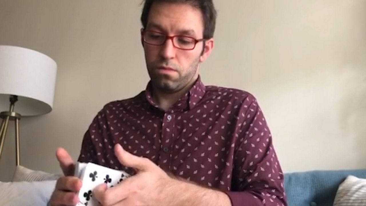 A man shuffling cards