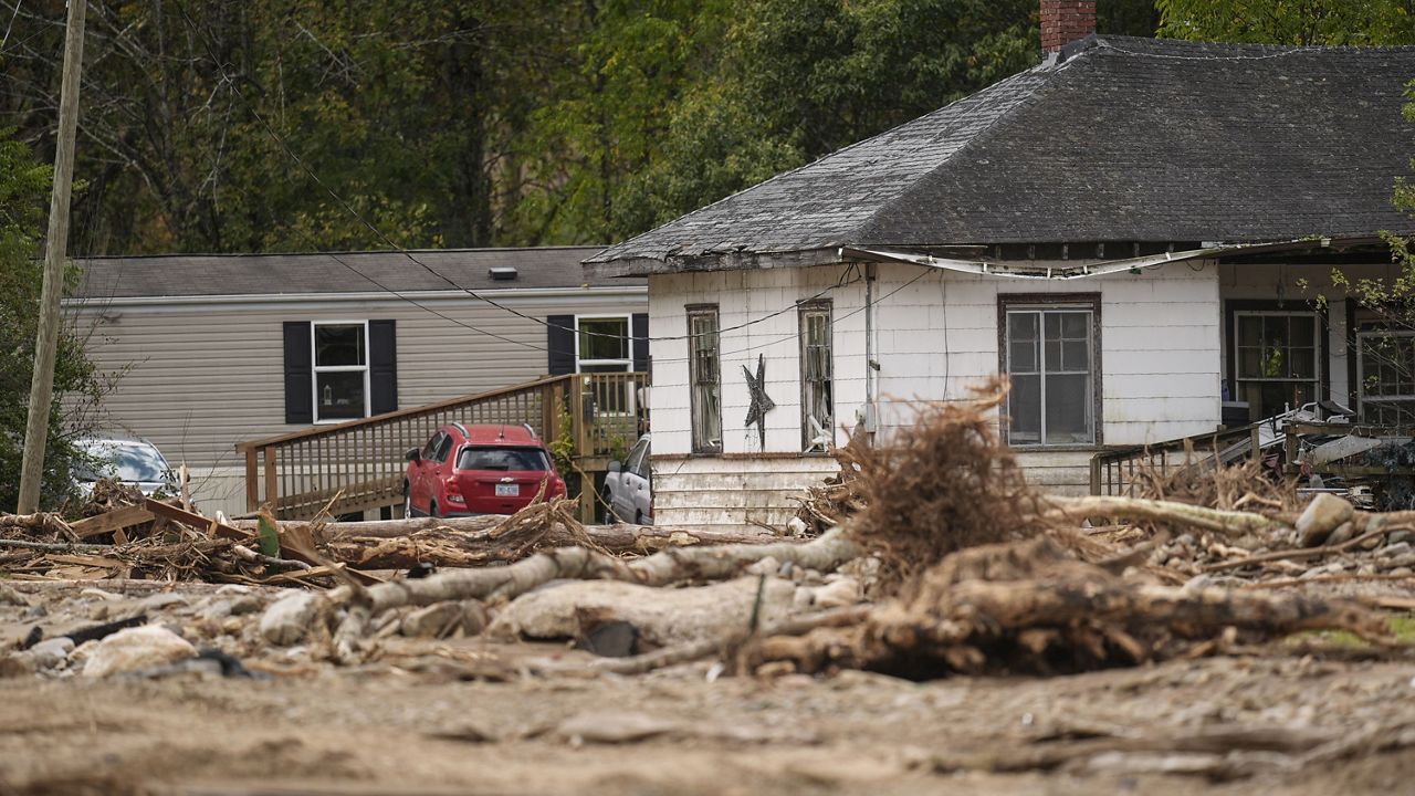 Homes lie in a debris field in the aftermath of Hurricane Helene, Thursday, Oct. 3, 2024, in Pensacola, N.C. (AP Photo/Mike Stewart)