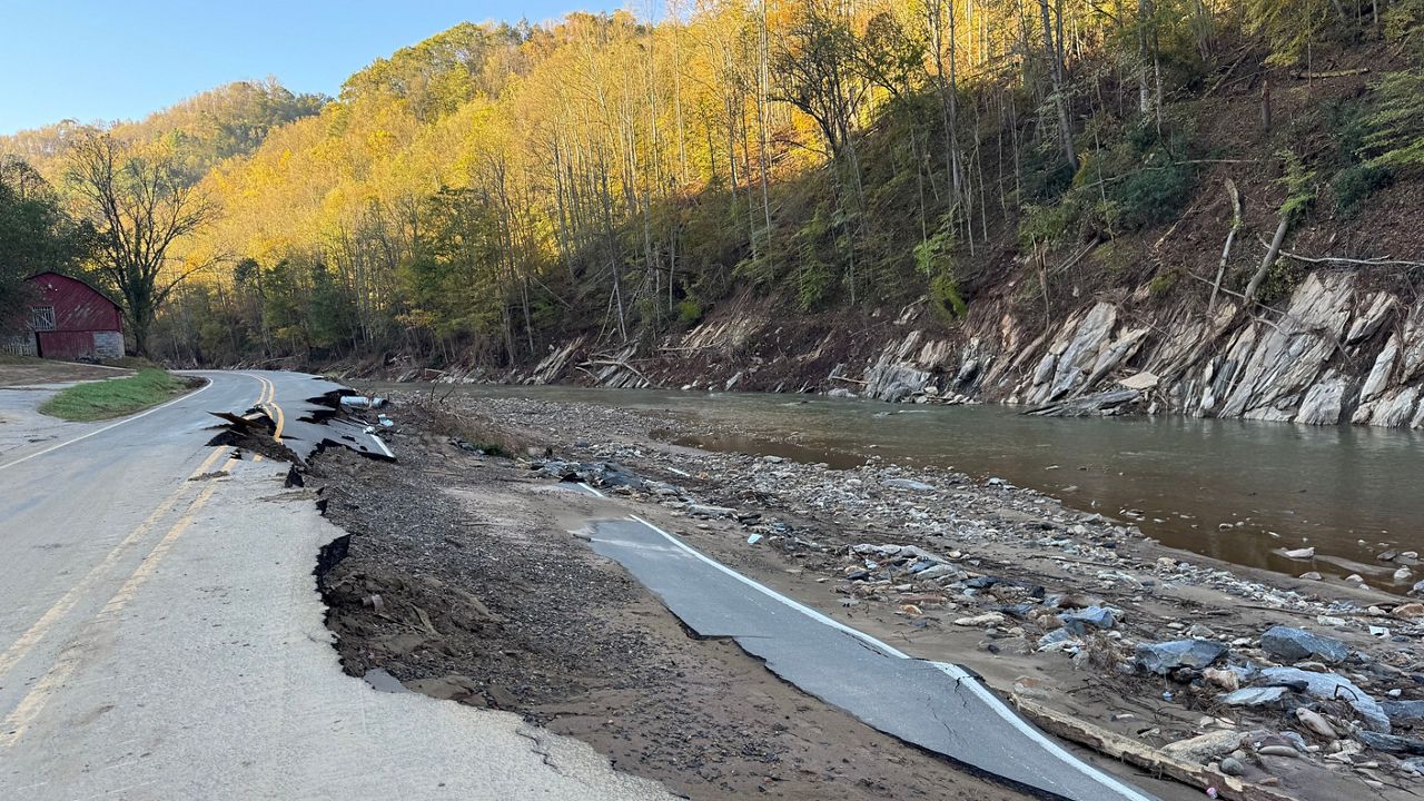 A road remains washed out after Hurricane Helene brought devastating flooding to western North Carolina late last month. (Spectrum News 1/Nick Buffo)