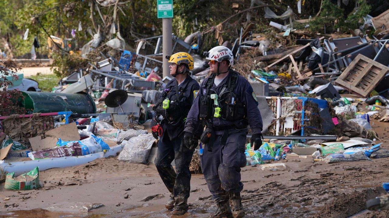 Search and rescue workers look for survivors of Hurricane Helene in Buncombe County, North Carolina, in September. A government spending bill passed Friday by Congress features disaster recovery funding, including $29 billion for the Federal Emergency Management Agency. (FEMA)