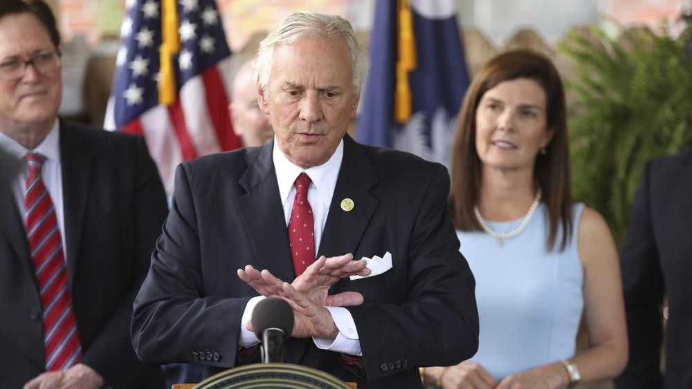 FILE - In this June 24, 2021, file photo, South Carolina Gov. Henry McMaster speaks during a ceremony to sign a bill preventing people from suing businesses over COVID-19 on Thursday, at Cafe Strudel in West Columbia, S.C. McMaster is one of several Republican state leaders opposing federal efforts to go door-to-door to urge people to get vaccinated against COVID-19. (AP Photo/Jeffrey Collins, File)
