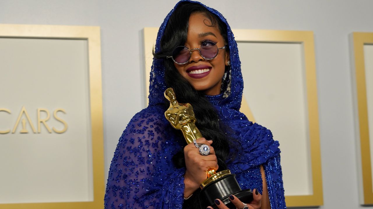 H.E.R., winner of the award for best original song for "Fight For You" from "Judas and the Black Messiah," poses in the press room at the Oscars on Sunday, April 25, 2021, at Union Station in Los Angeles. (AP Photo/Chris Pizzello, Pool)