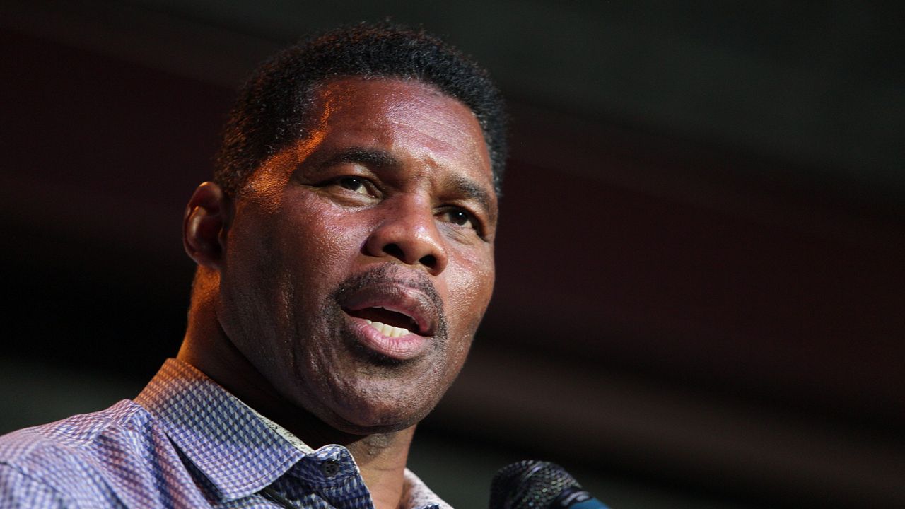 Herschel Walker, GOP candidate for the US Senate for Georgia, speaks at a primary watch party on May 23, 2022, at the Foundry restaurant in Athens, Ga. AP Photo/Akili-Casundria Ramsess, File)