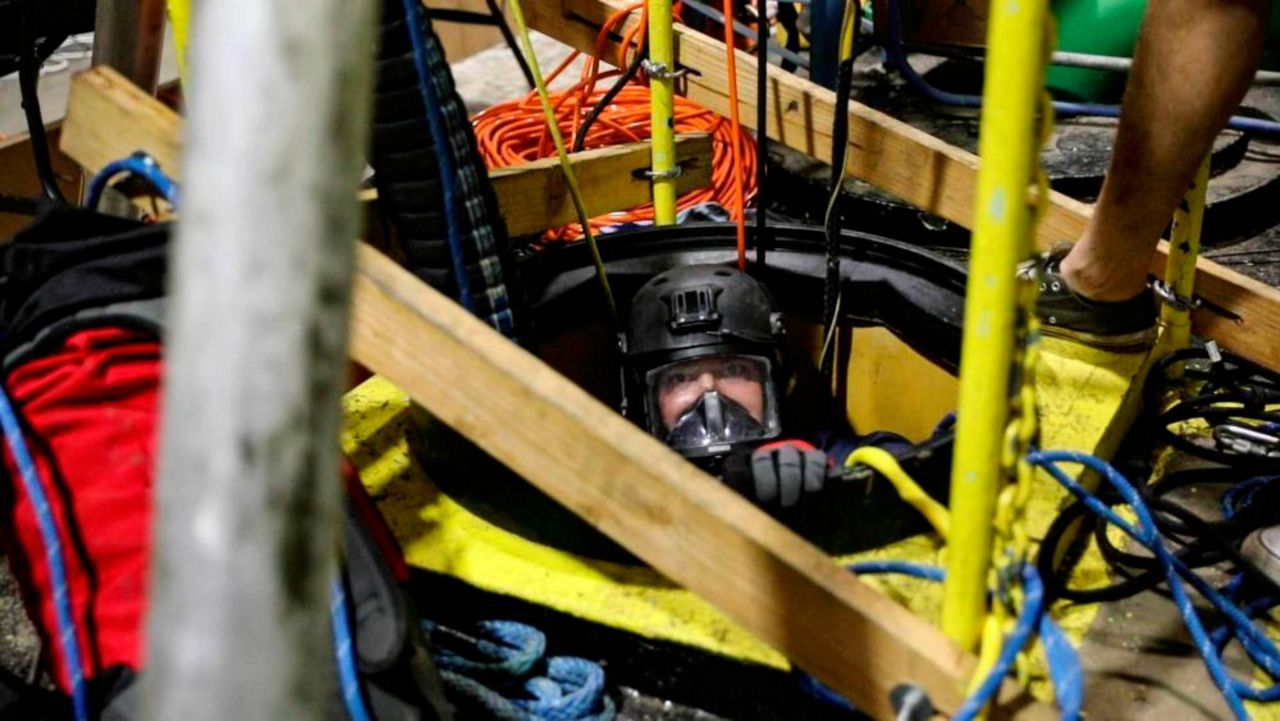 Mobile Diving Salvage Unit One performs inspection and sampling of a water well near Pearl Harbor, Hawaii on Dec. 21, 2021. (U.S. Navy photo by Mass Communication Specialist 2nd Class Aja Bleu Jackson via AP)