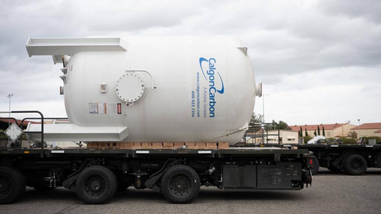 A Modular Carbon Adsorption System, destined for Red Hill as part of the U.S. Transportation Command Red Hill water movement, sits on a K loader Dec. 15, 2021, at Travis Air Force Base, California. (Hun Chustine Minoda/DVIDS)